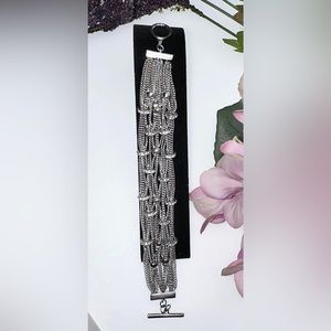 AES signed multi-row rhinestone accents chain toggle 8” long bracelet.